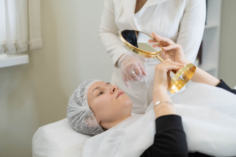 Client examines her skin post-treatment, the reflection of satisfaction. A personalized skincare journey with visible results
